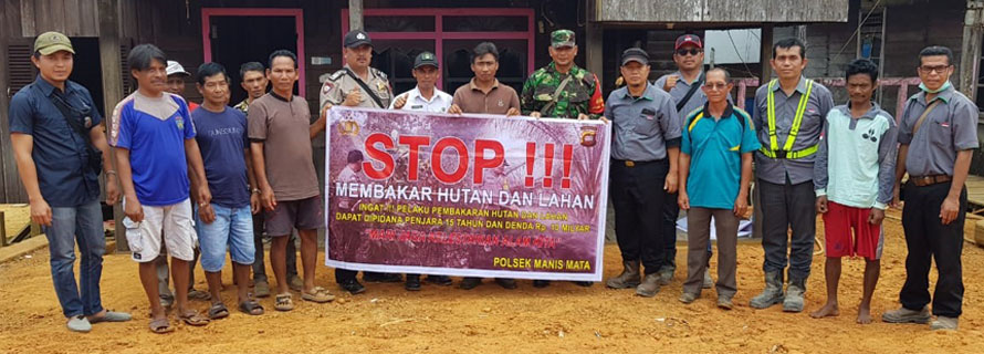Fire awareness program group photo with people holding sign
